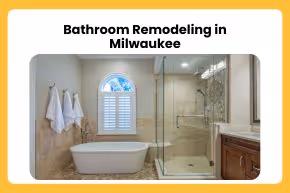 Modern bathroom with freestanding bathtub, glass-enclosed shower, wooden vanity, and beige tiled walls under a window with shutters.