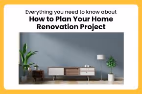 Modern living room with a wooden media console, potted plant, and a floor lamp against a gray wall.