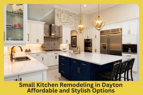 Modern small kitchen with white countertops, navy blue island with seating, stainless steel appliances, and decorative tile backsplash.